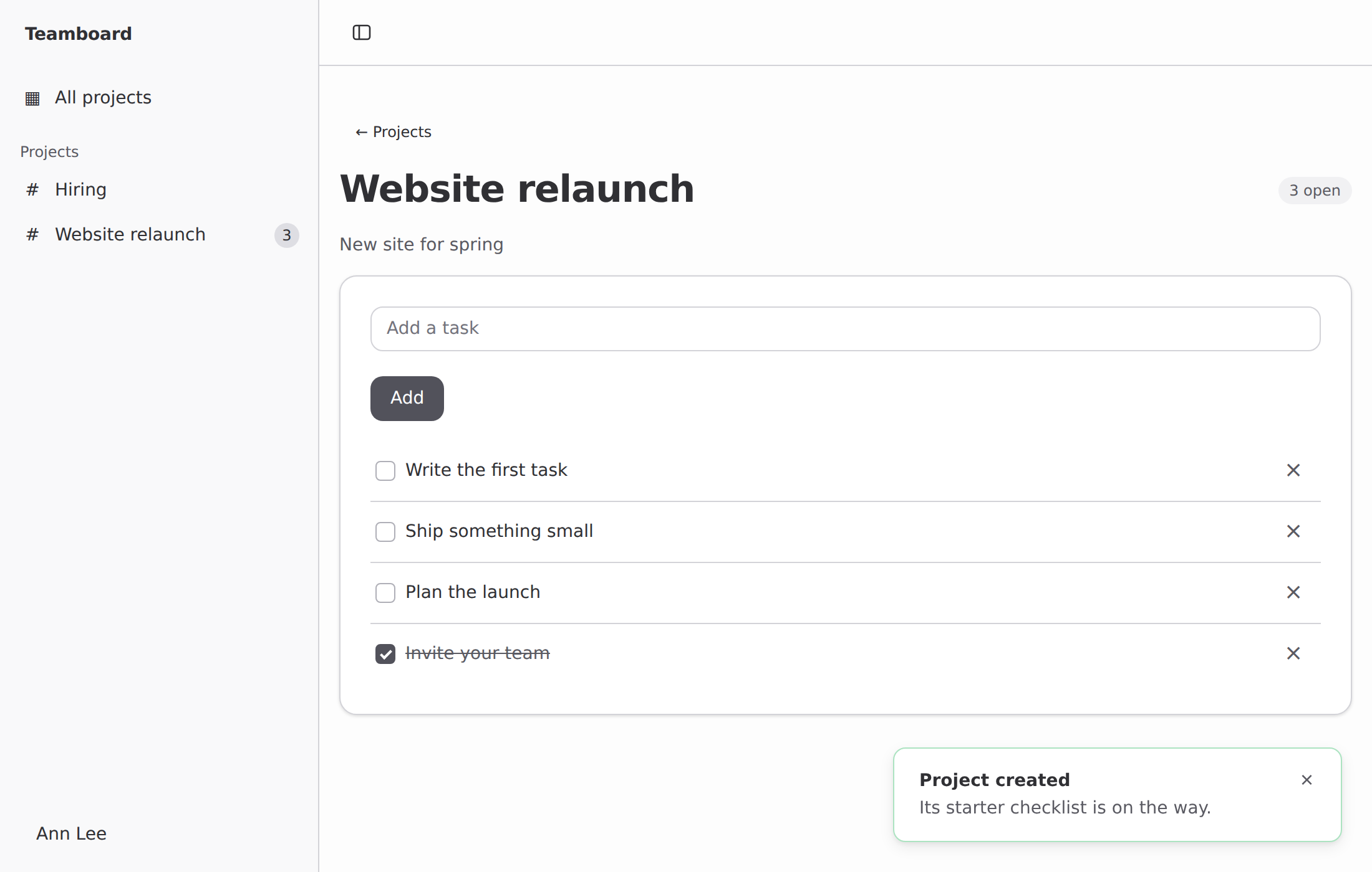 Teamboard: a sidebar of projects, a live task list and a toast
