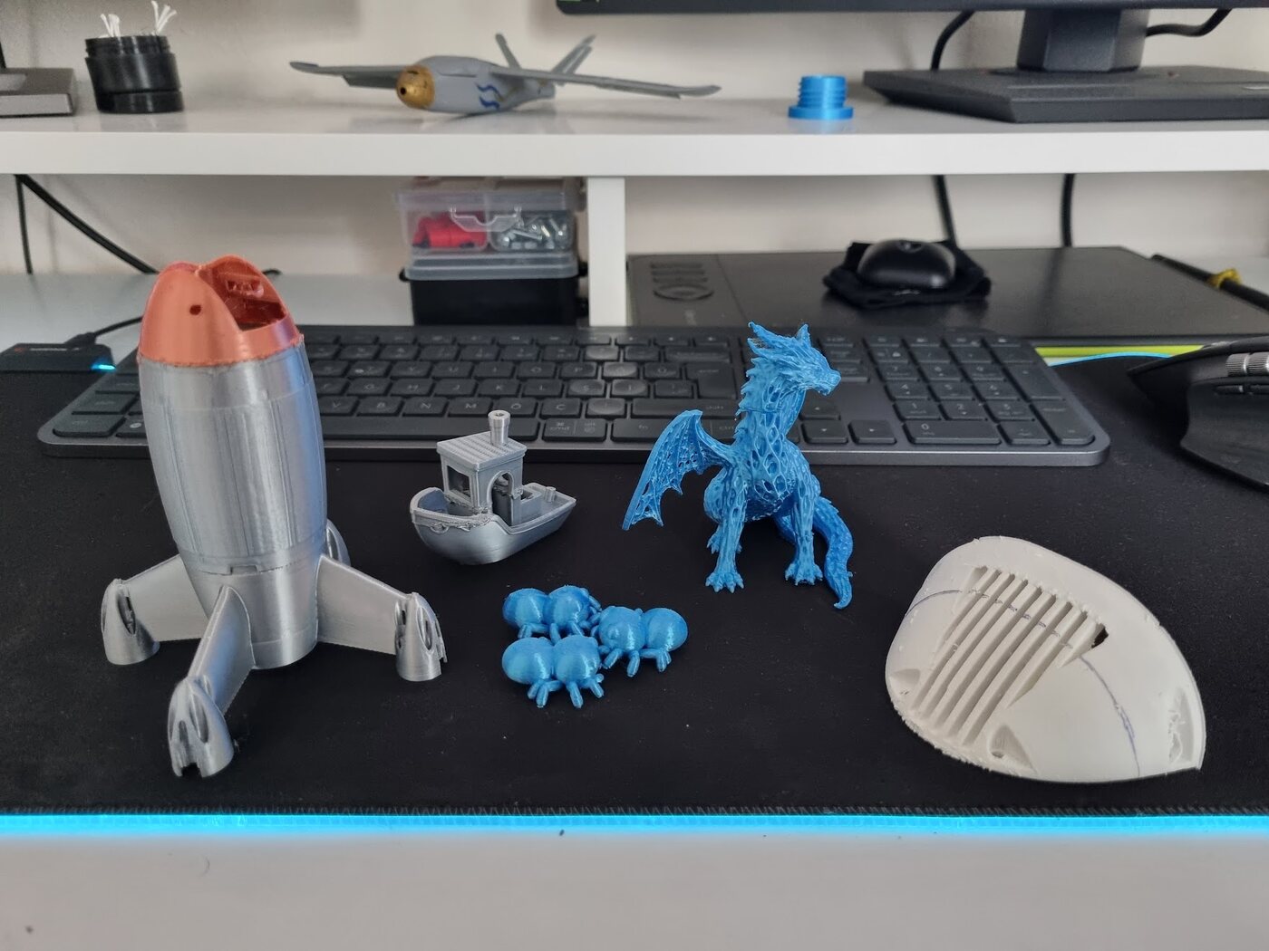 The five rescued test prints: rocket drone body, Benchy, spiders, dragon and plane nose cover