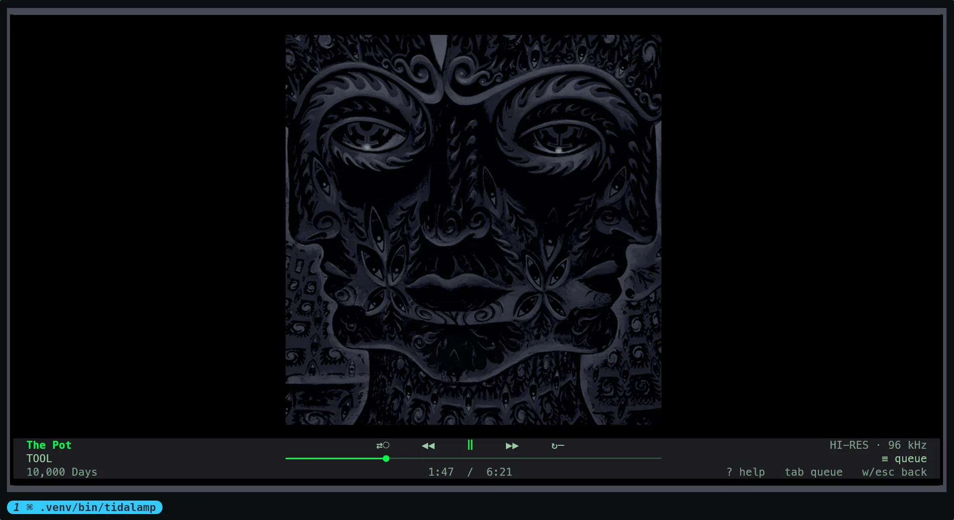 The full-screen view: an album cover centred on a black ground, and a bar at the foot with the track, artist and album on the left, the shuffle, previous, pause, next and repeat controls over the seek bar and the times in the middle, and the quality, the queue button and the keys on the right