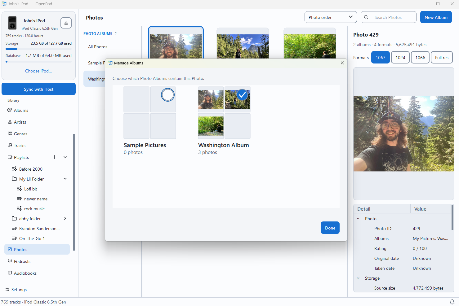 Photo Library with the Manage Albums dialog and selected photo inspector