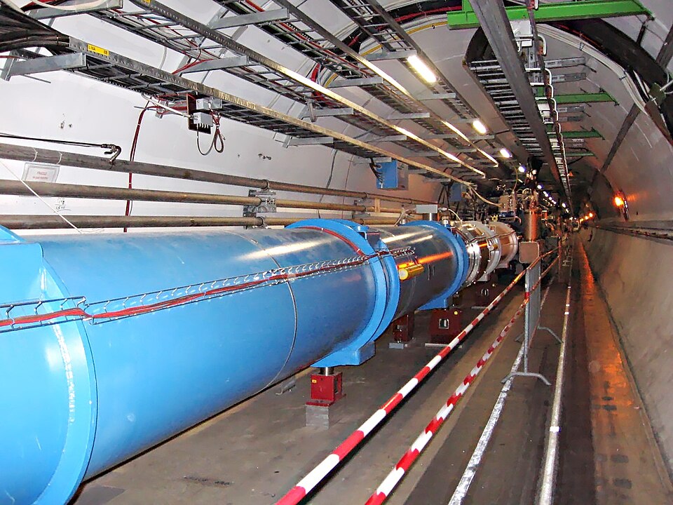 the LHC tunnel: the blue dipole magnet string curving into the distance