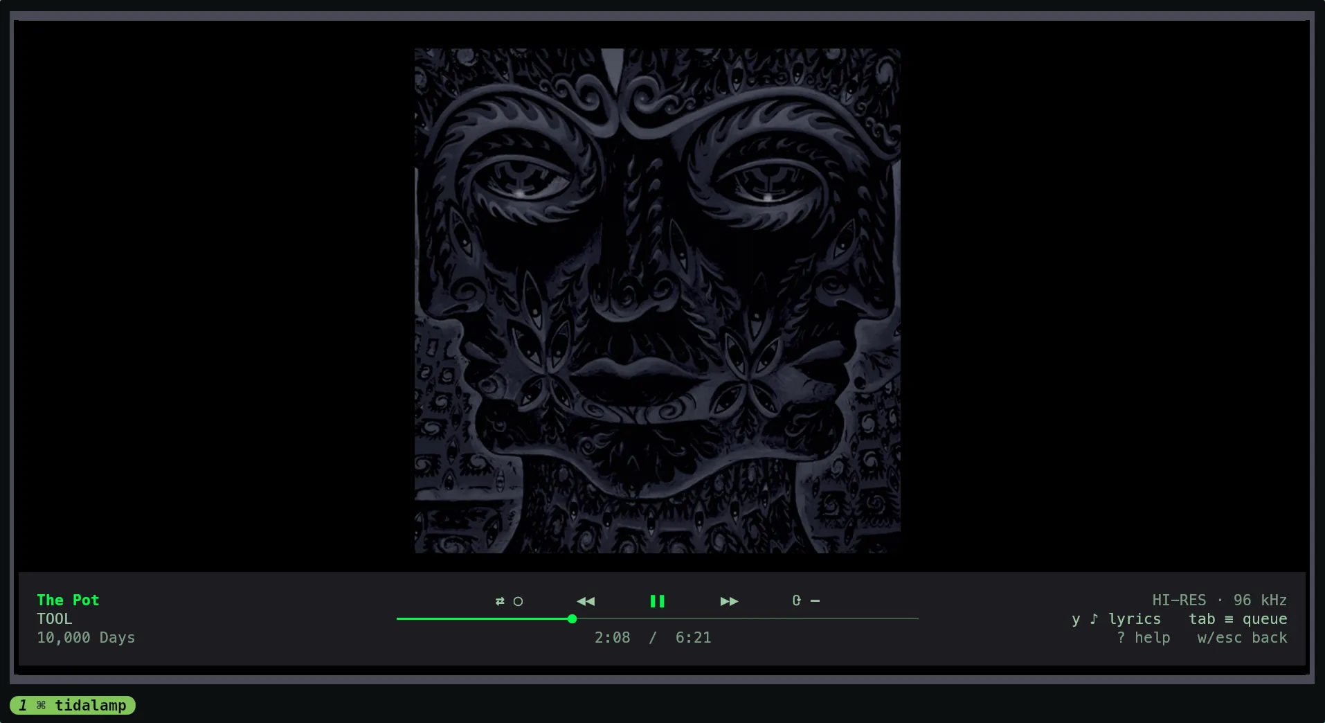The full-screen view: an album cover centred on a black ground, and a bar at the foot with the track, artist and album on the left, the shuffle, previous, pause, next and repeat controls over the seek bar and the times in the middle, and the quality, the queue button and the keys on the right