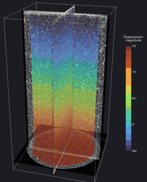 Foam cylinder with orthogonal micro-CT slices; a colour map of displacement magnitude sweeps through it
