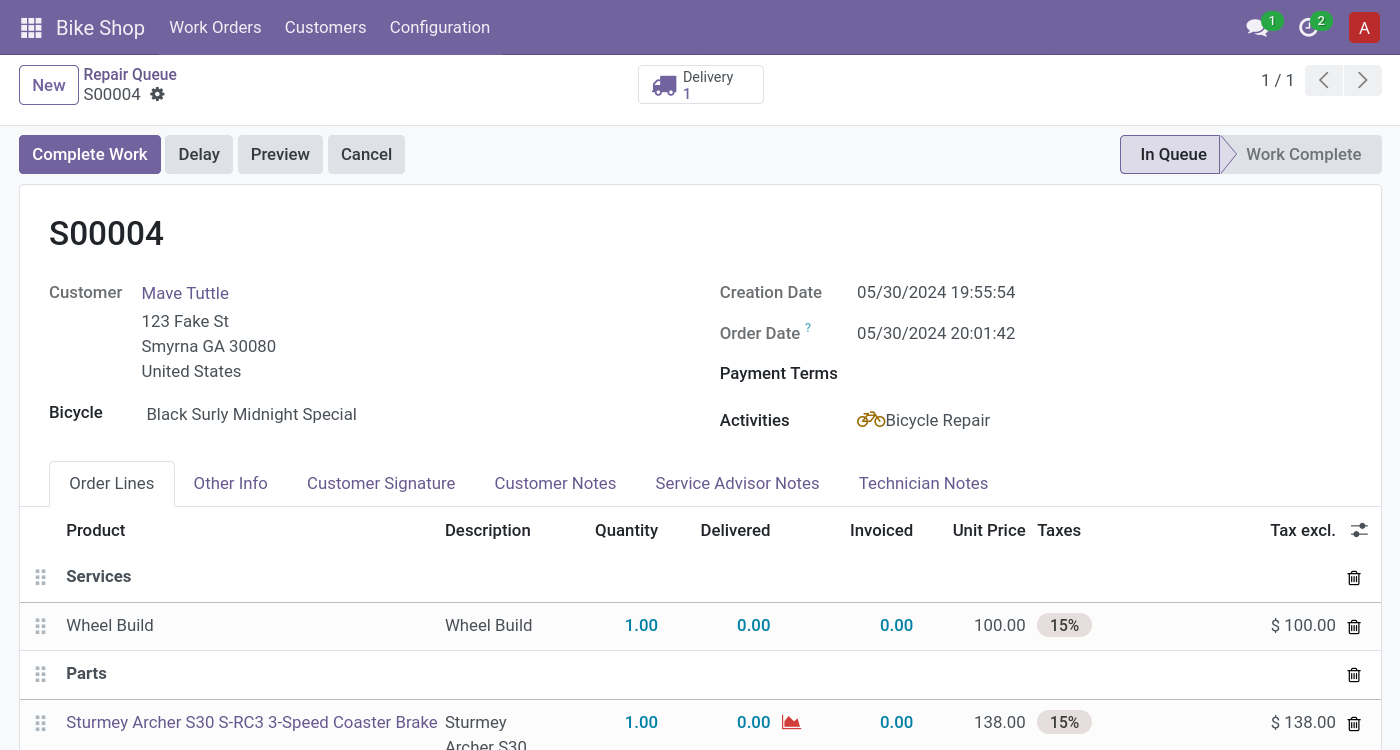 A screen displaying a customer name and address, a bicycle, and a break down of several parts and services.