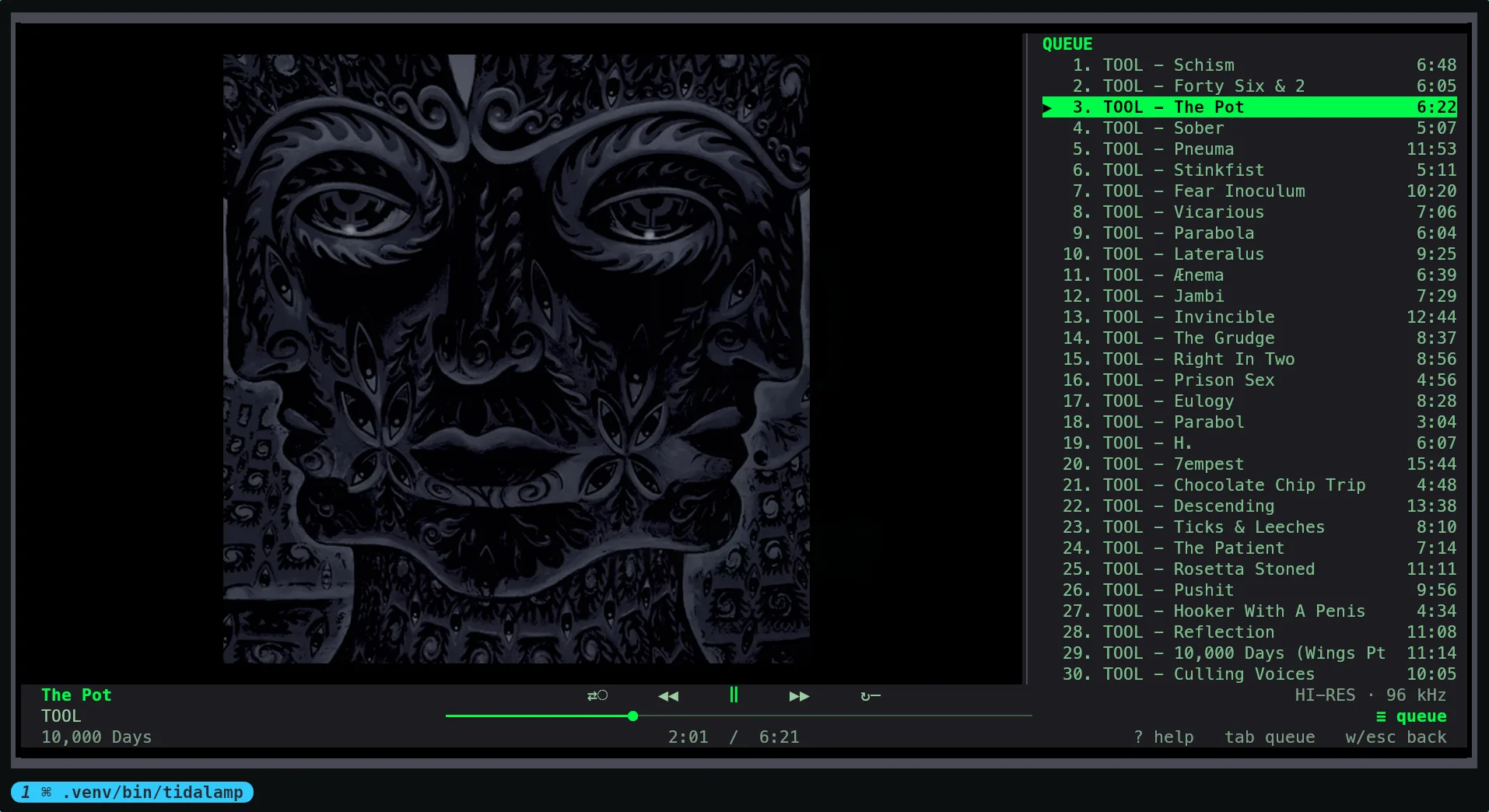 The same view with the queue open on the right: thirty numbered tracks with their lengths, the playing one highlighted, and the cover shifted left to make room