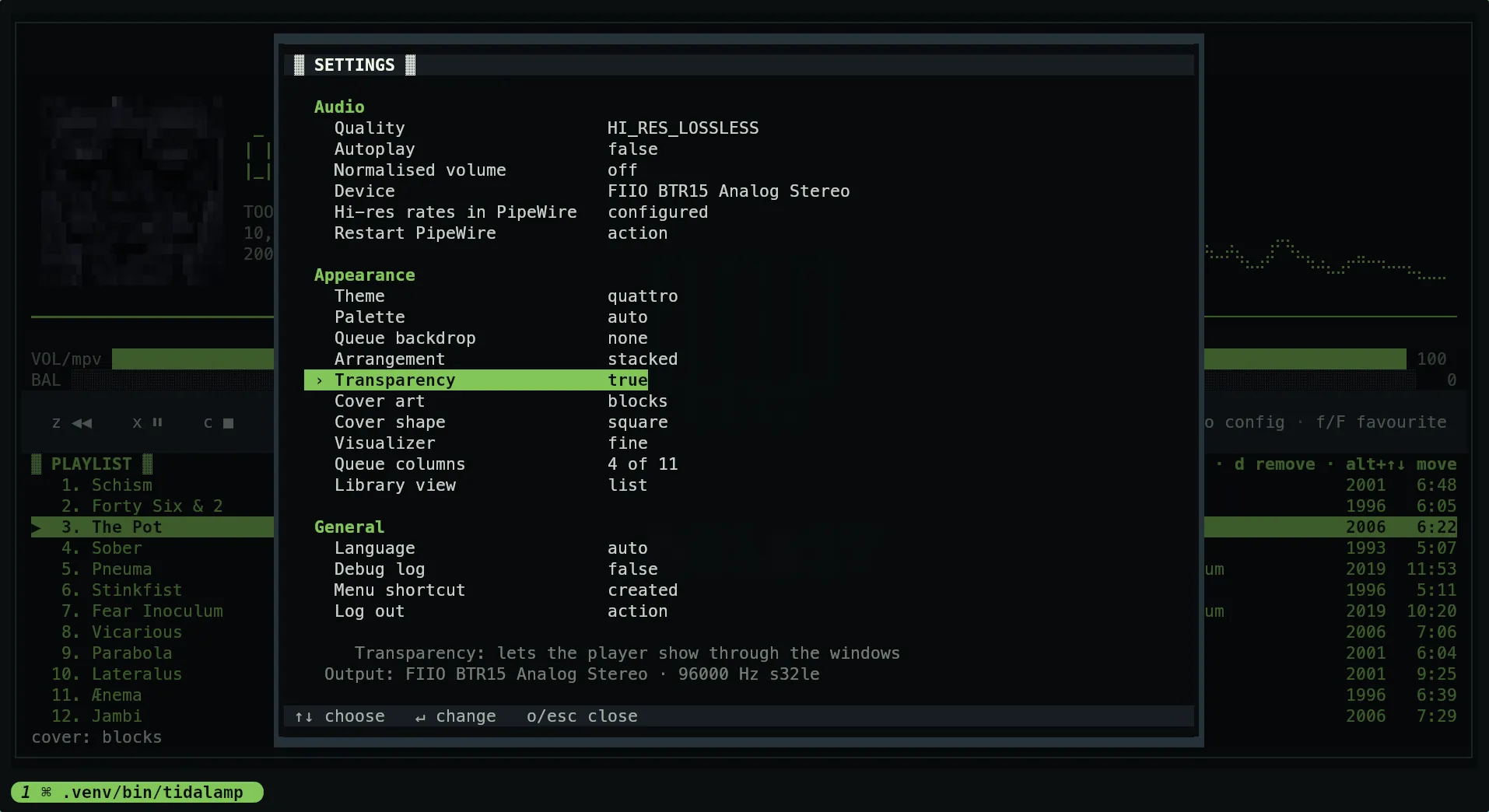 The settings window over a translucent scrim, with the player dimmed behind it: transparency is on and the cover has been moved to blocks